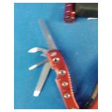 Snap-on brand red multi-tools and a matching flashlight.