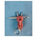 Snap-on brand red multi-tools and a matching flashlight.