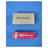 Woodcraft folding pocket knife featuring a wooden handle with the brand logo.