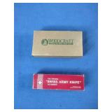 Woodcraft folding pocket knife featuring a wooden handle with the brand logo.