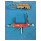 Woodcraft folding pocket knife featuring a wooden handle with the brand logo.