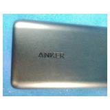 Anker PowerCore 20100mAh portable charger in black, Black Simmons 8x21mm SCL Model 1156 compact binoculars, and Book light featuring the Nikon logo