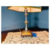 Vintage nautical-themed table lamp with doily