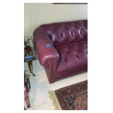 Red leather couch 7’ long