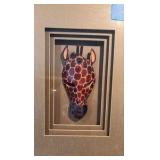 Giraffe and Zebra Masks in framed shadow boxes