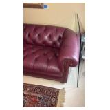 Red leather couch 7’ long