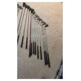 Golf clubs with Titleist golf bag