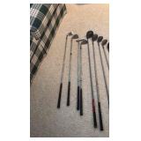 Golf clubs with Titleist golf bag