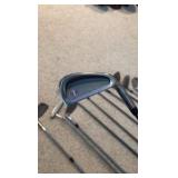 Golf clubs with Titleist golf bag