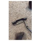Golf clubs with Titleist golf bag