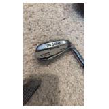 Golf clubs with Titleist golf bag