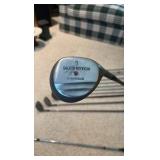 Golf clubs with Titleist golf bag