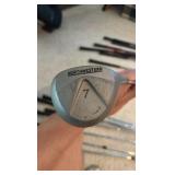 Golf clubs with Titleist golf bag