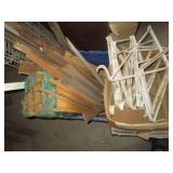Plastic tote containing long wood d...