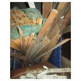 Plastic tote containing long wood d...