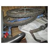 Contents of a shelf including tires, Huffy bike and more!