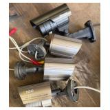 four cameras and bag of wire
