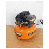 RIDGID 6 Gal. 150 PSI Portable Electric Oil-Free Jobsite Pancake Air Compressor with Dual Pressure Gauges and 2-Quick Couplers