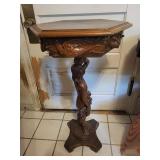 Carved Wood Pedestal Table with Female Figure Support and Floral Inlay Border