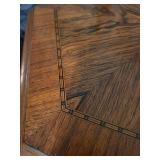 Carved Wood Pedestal Table with Female Figure Support and Floral Inlay Border