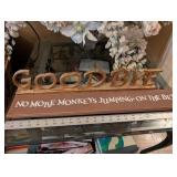 Decorative Floral Arrangement in Clear Crystal Vase and two decorative signs