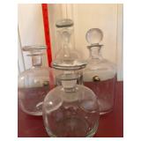 4 Clear Glass Decanters with Stoppers Mixed Shapes Barware Set