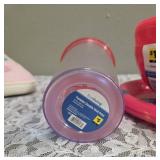 2 sets of Plastic Red Plates (4 in each set) and 2 sets of Plastic Red Bowls (4 in each set). 2- Party Time Tumblers, and Ladies Slippers Size 7-8
