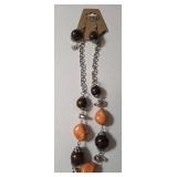 Necklace , Earrings, Bracelet.  Shades of orange and brown.