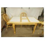Light Oak Dining Set. Table is 36"x45" with white tile inlay, flip-up leaf (15"), and 4 chairs