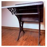 Antique School Desk with Ornate Cast Iron Supports and Foldable Wooden Seat