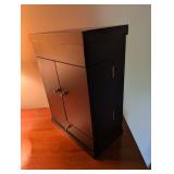 Black Wooden Jewelry Armoire With Watch Rolls and Drawer