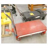 Red hydraulic table lift cart with foot pump