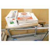 Work table on wheels with contents