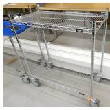 2 wire shelving carts on wheels and contents