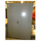 Two door parts storage cabinet lined with parts bin hangers