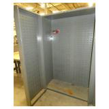 Two door parts storage cabinet lined with parts bin hangers