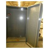 Two door parts storage cabinet lined with parts bin hangers