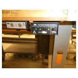 60x30 Workbench with laminate top and steel legs, adjustable height and a parts bin hanger