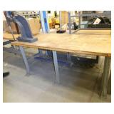 DAKE Arbor press 1-1/2 Ton mounted on a 72x36 workbench with wood top and steel legs, adjustable height