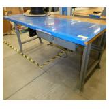 72x36 Workbench with wood top and steel legs, and a couple of drawers, top is covered with a plastic