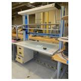lab workbench with multiple electrical plugs and overhead light