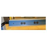 lab workbench with multiple electrical plugs and overhead light