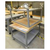 Two 30x38 rolling tables with wood top and steel base