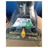This upright cleaning machine is a Hoover Max Extract 60 Pressure Pro Carpet Deep Cleaner (Model FH50220). It is pictured next to a multi-purpose carpet cleaning formula