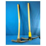These are pick mattocks, commonly used for digging in hard soil or cutting through roots