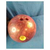 This is a 15 pound Dyno-Thane The Thing Returns bowling ball featuring a red and maroon swirl pattern