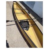 Wenonah Wee Lassie solo canoe featuring a lightweight hull and a kayak-style paddle.