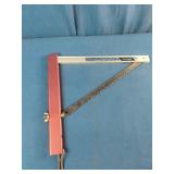 This is a Sven-Saw folding camping saw with a red aluminum handle.