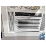 Midea EasyCool Window Air Conditioner with mechanical controls and a 5,000 BTU cooling capacity.