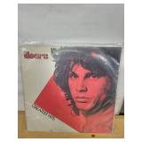 The Doors Greatest Hits, Janis Joplin Kozmic Blues, Lps and Janis Joplin Portrait Printed on a Dictionary Page (Lot of 3)